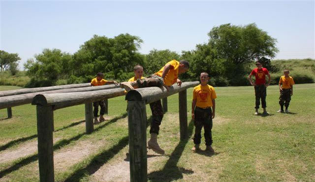 a low hurdle log obstacle on the Marine Corps obstacle course