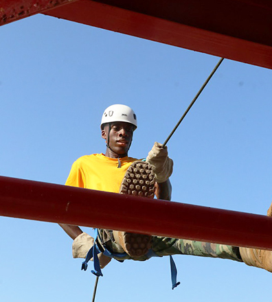 summer camper on the helicopter skid rappel